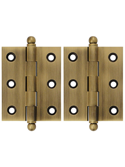 Pair of Solid Brass Cabinet Hinges - 2 1/2 inch x 2 inch in Antique Brass.